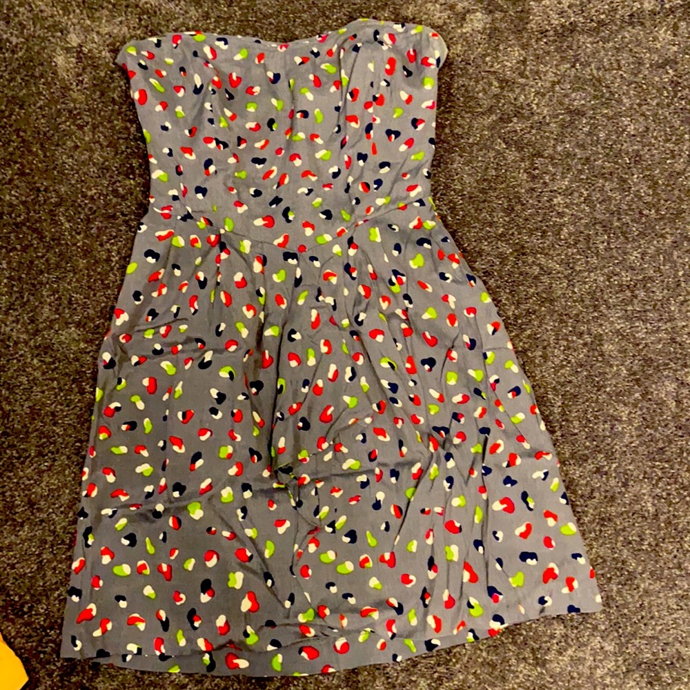 Super cute strapless mini dress with ruffle detail on front